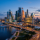 Photorealistic dusk skyline of modern glass office towers representing a tech innovation hub.